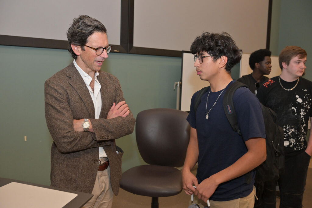 Dr. John J. Kaag speaking with student